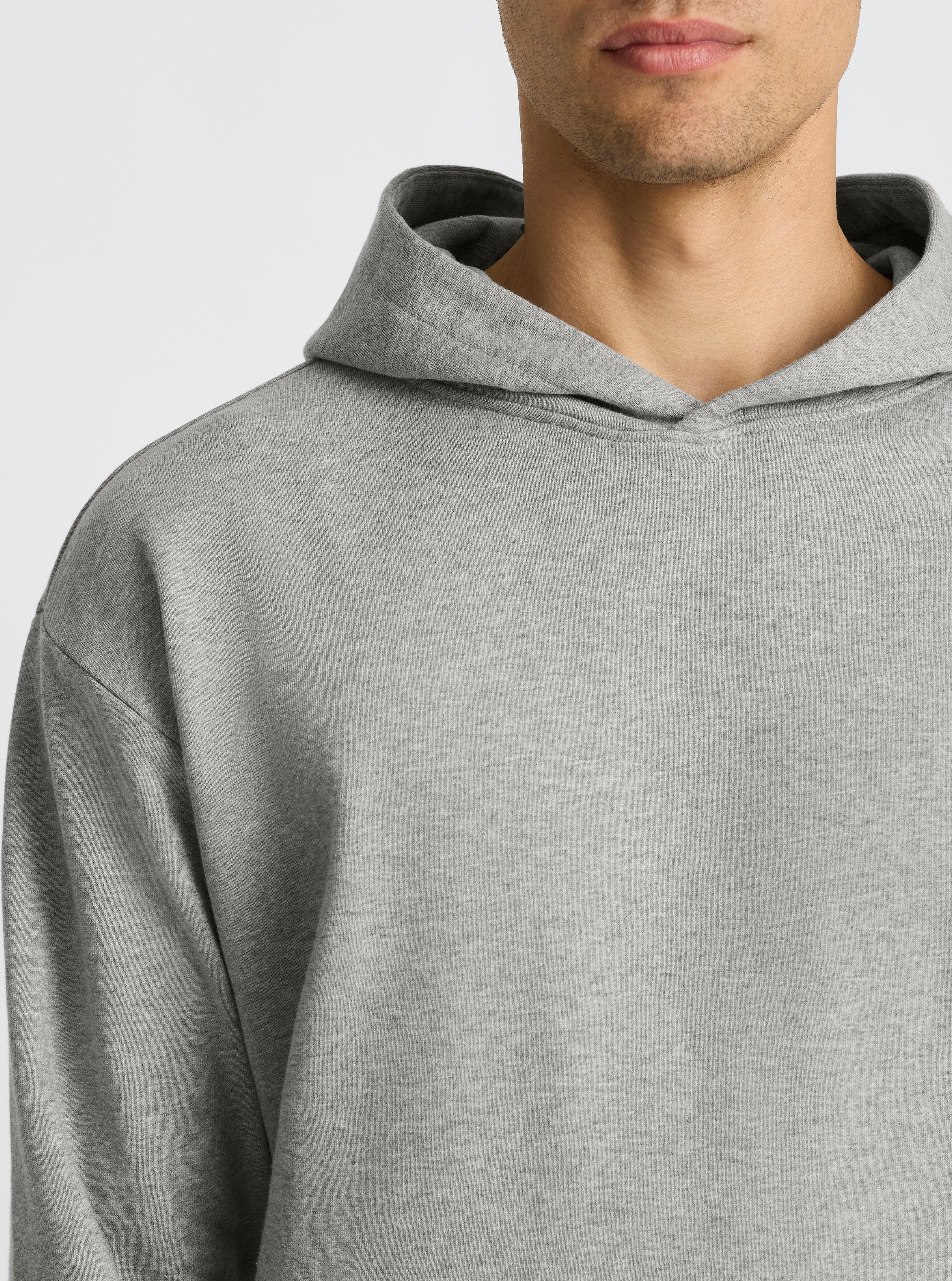 Grey Marl|Good Earth Cotton® Hoodie for men – Sustainable Cotton Hoodie|Evans is 6’2” and wearing a size M