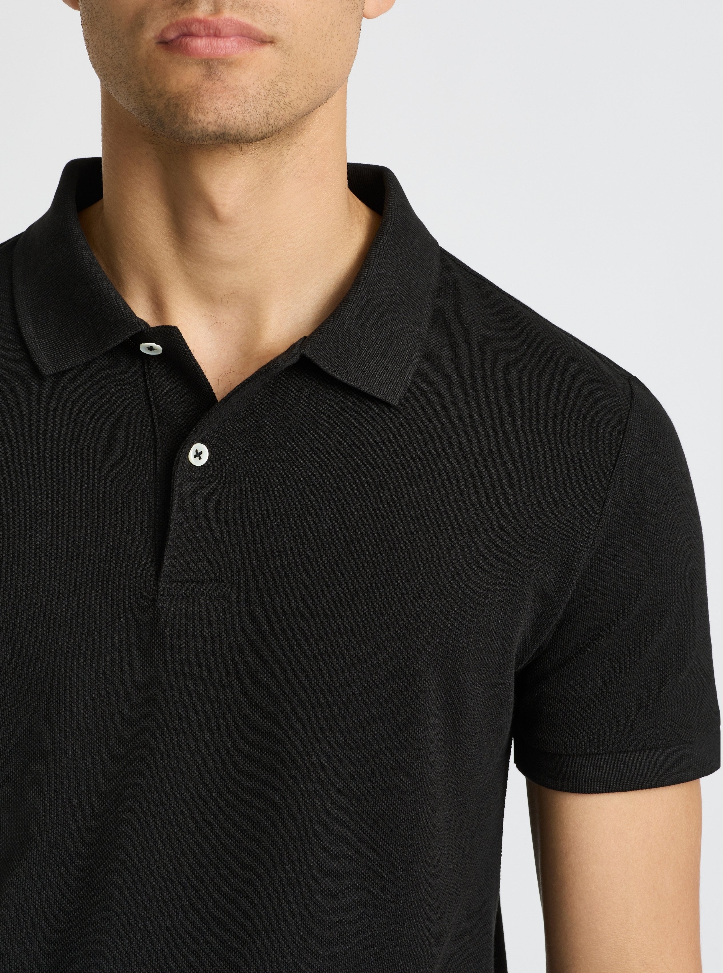 Black|Good Earth Cotton® Polo – Sustainable Cotton Polo|Evans is 6’2” and wearing a size M